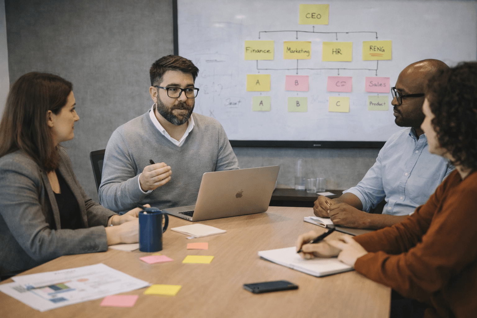 man drawing on dry-erase board