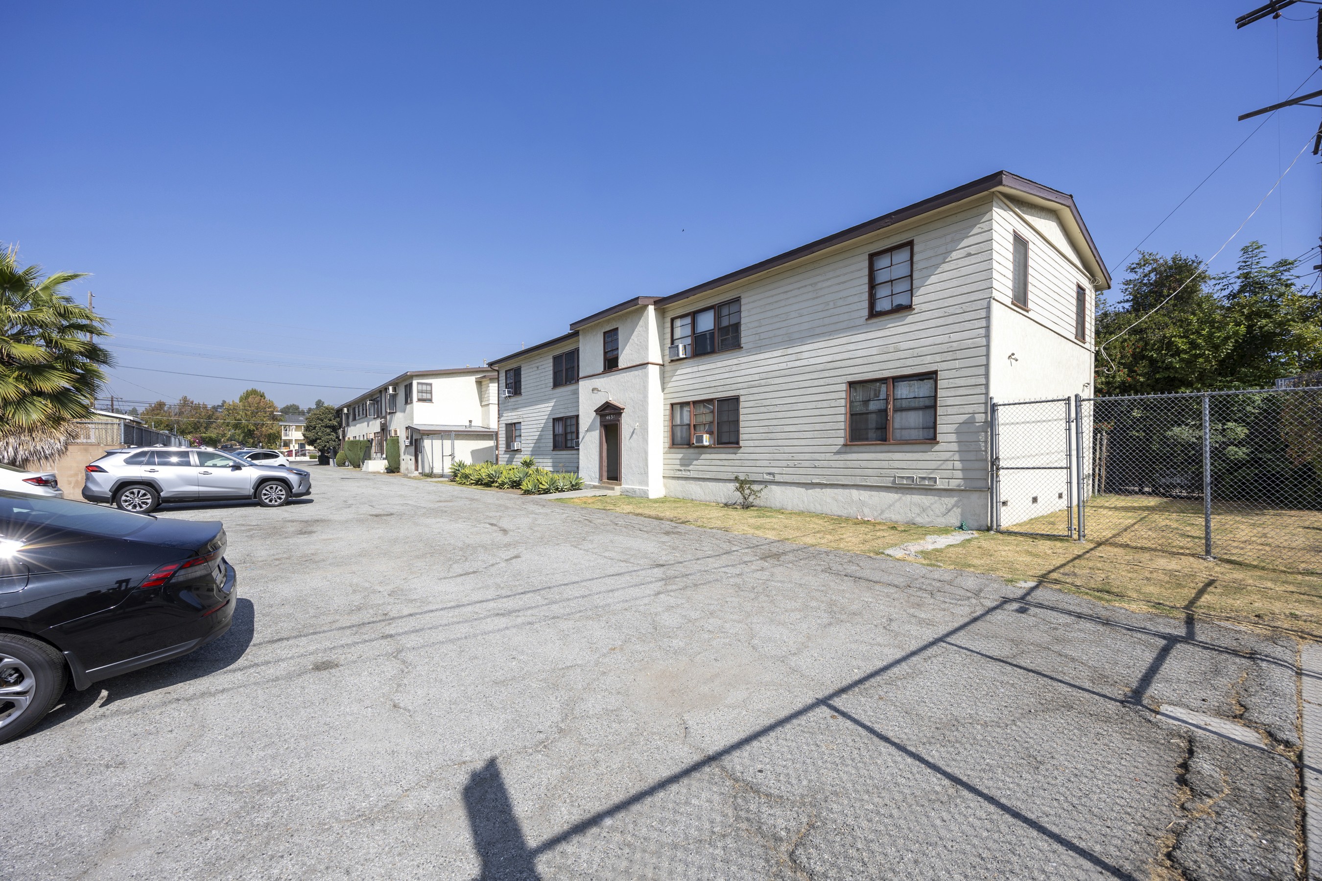 Rear parking lot and multi-building layout showing access and density at 4650 york.