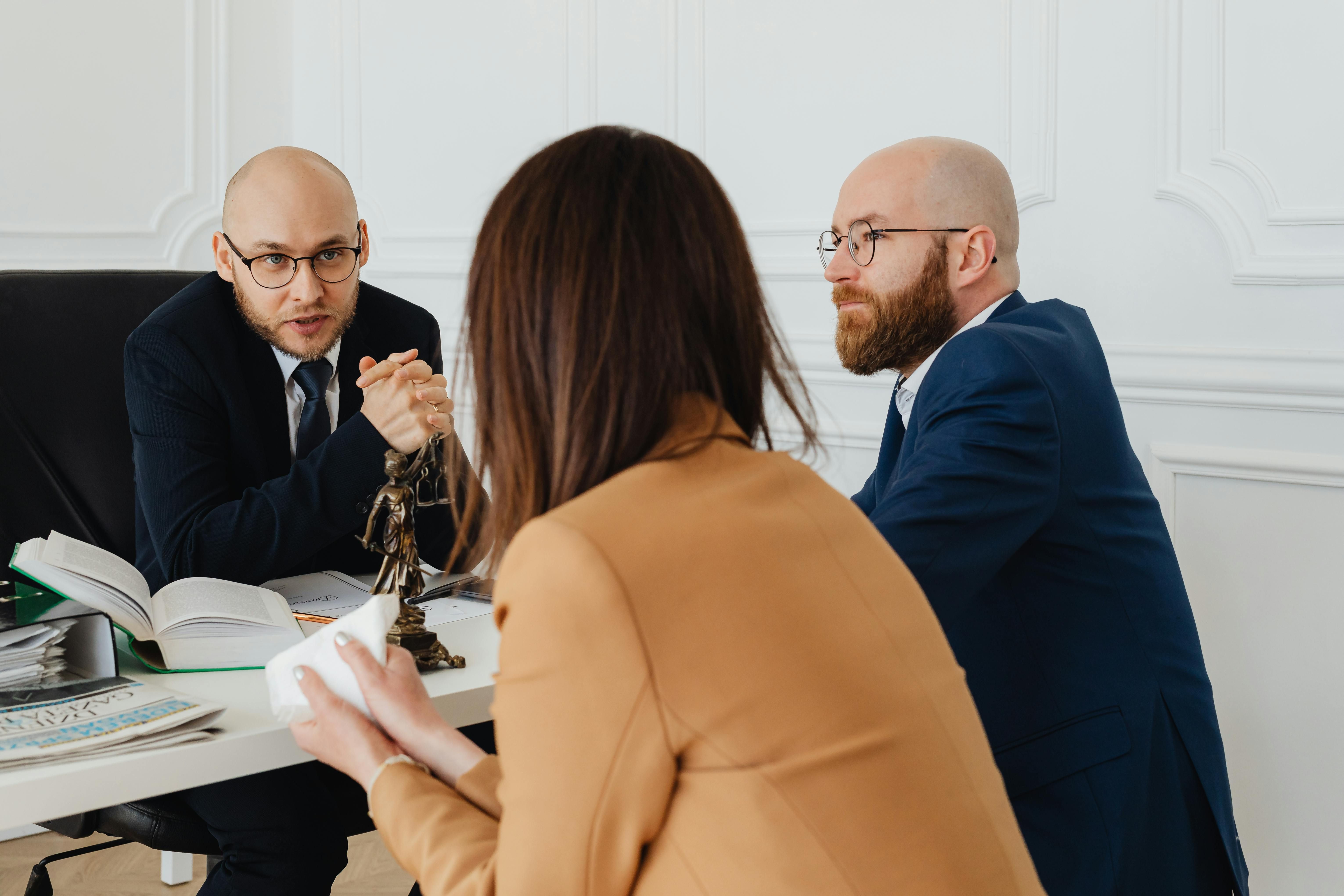 Woman in meeting with legal professionals
