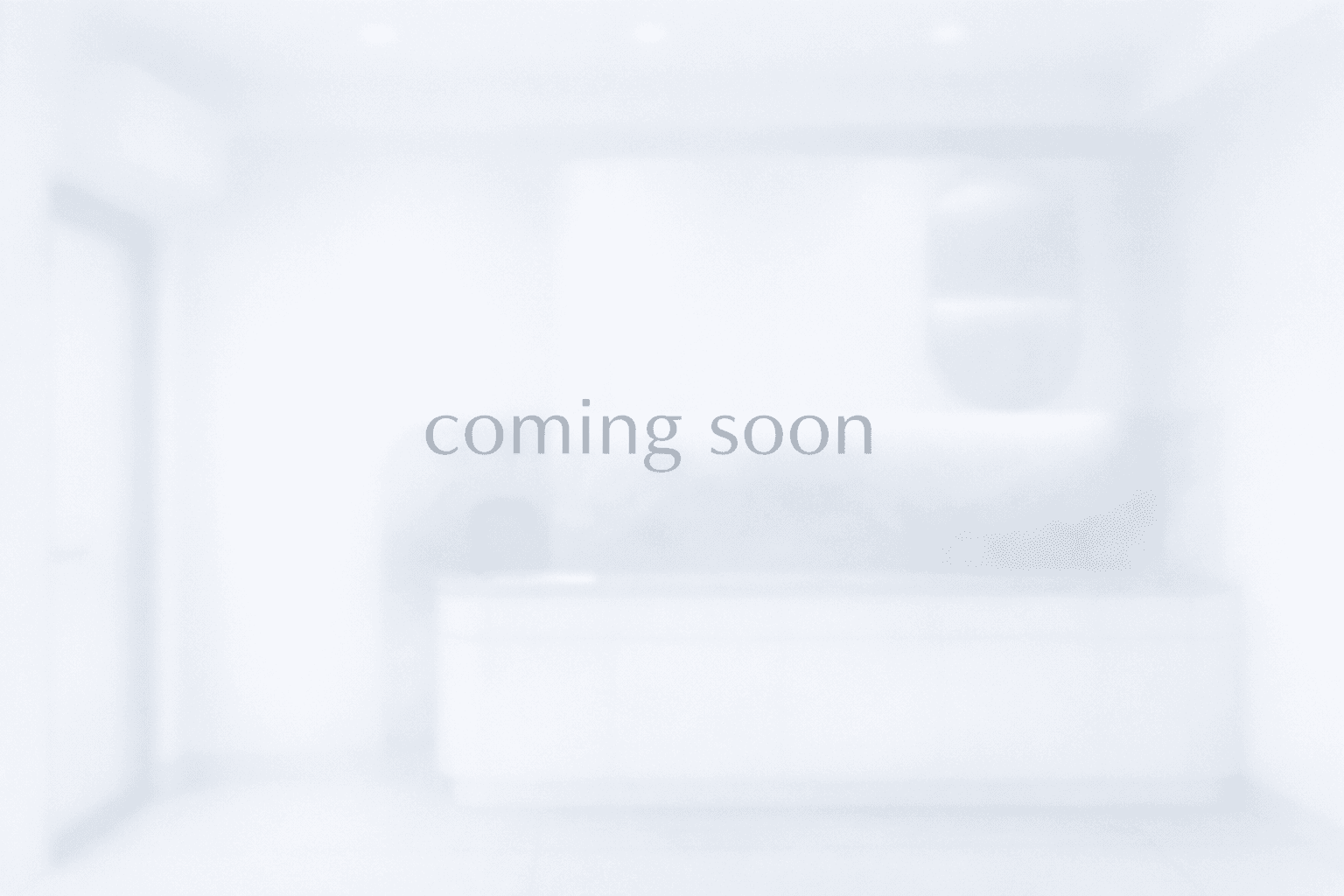 a purple chair sitting in a room next to a desk