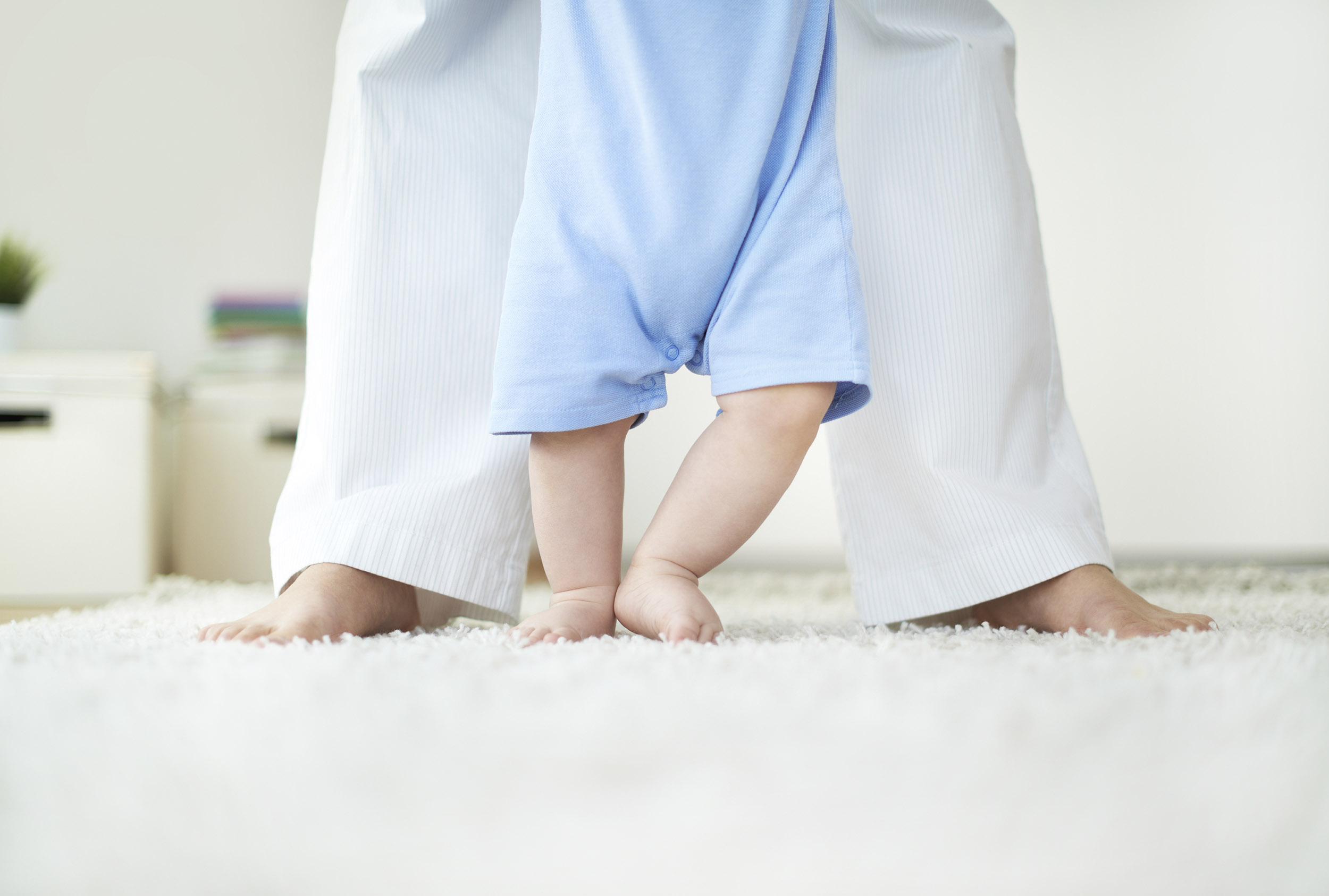 Baby feet on clean carpet