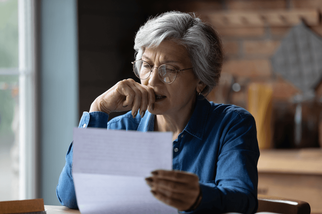 old woman is anxious on cost of living and  rising bills