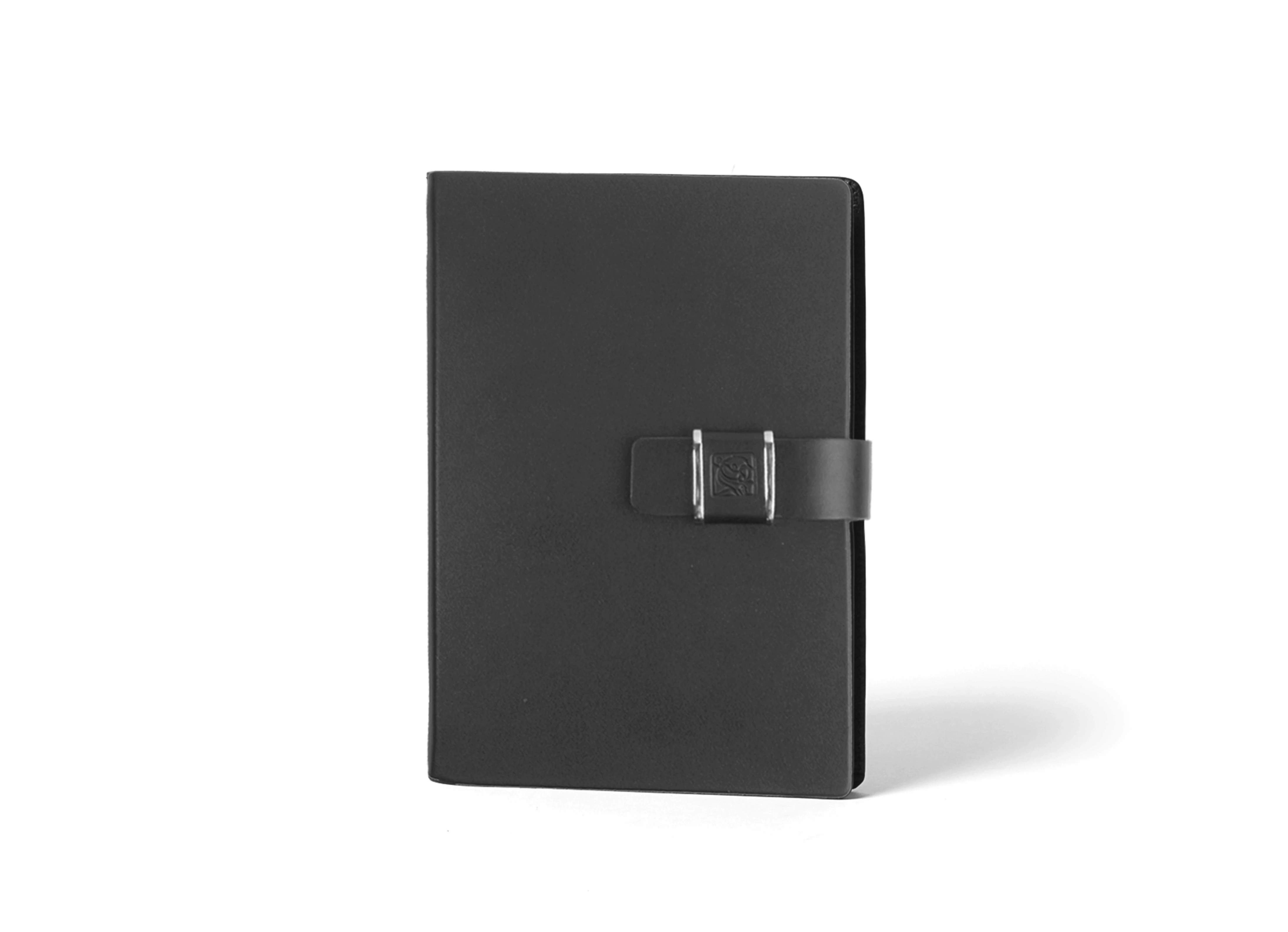 Front view of standing black notebook with unique metal belt closure.