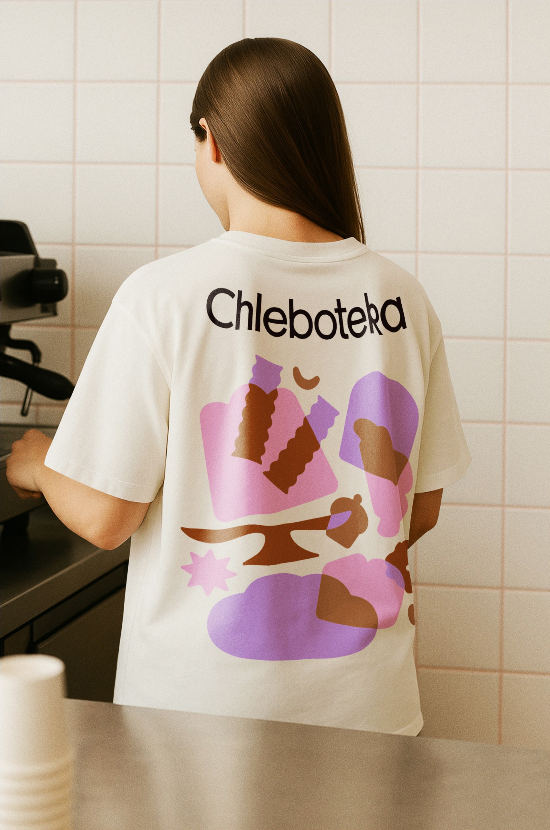 Chleboteka branded wrapping paper with copper logo pattern under a seeded loaf, packaging design detail