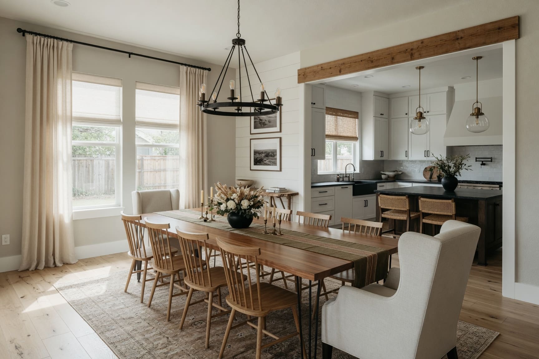 Dining room with farmhouse table and view into kitchen