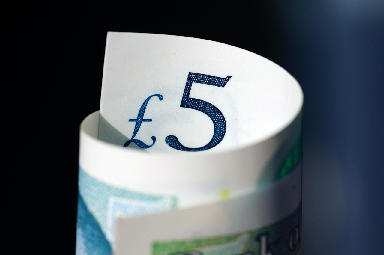 £5 banknote curled up
