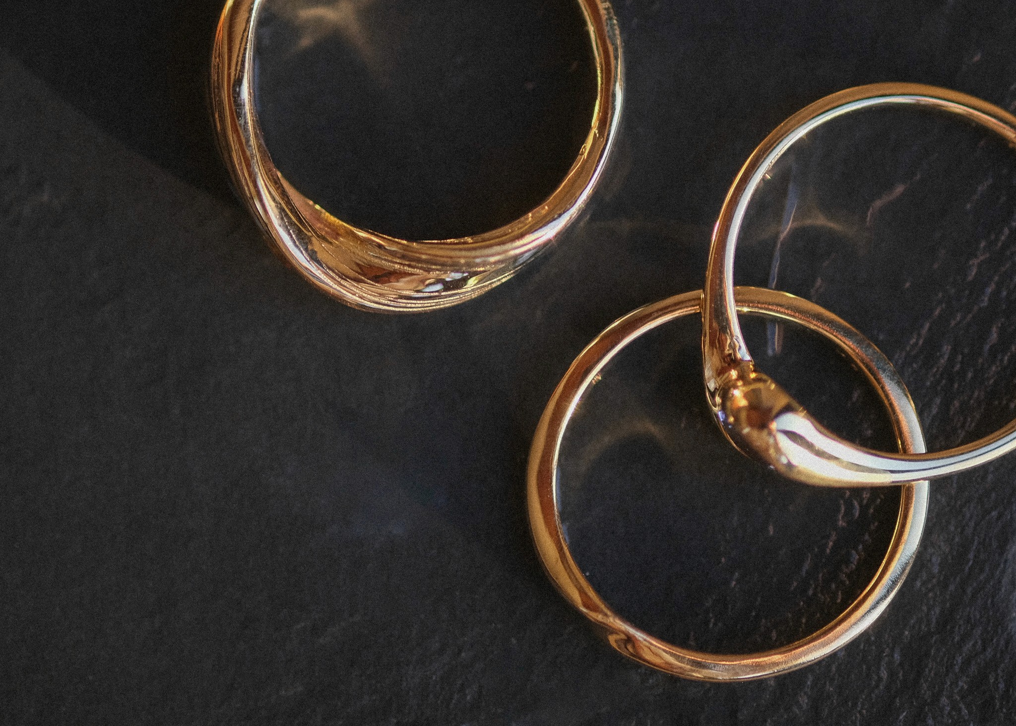Three gold rings photographed from above