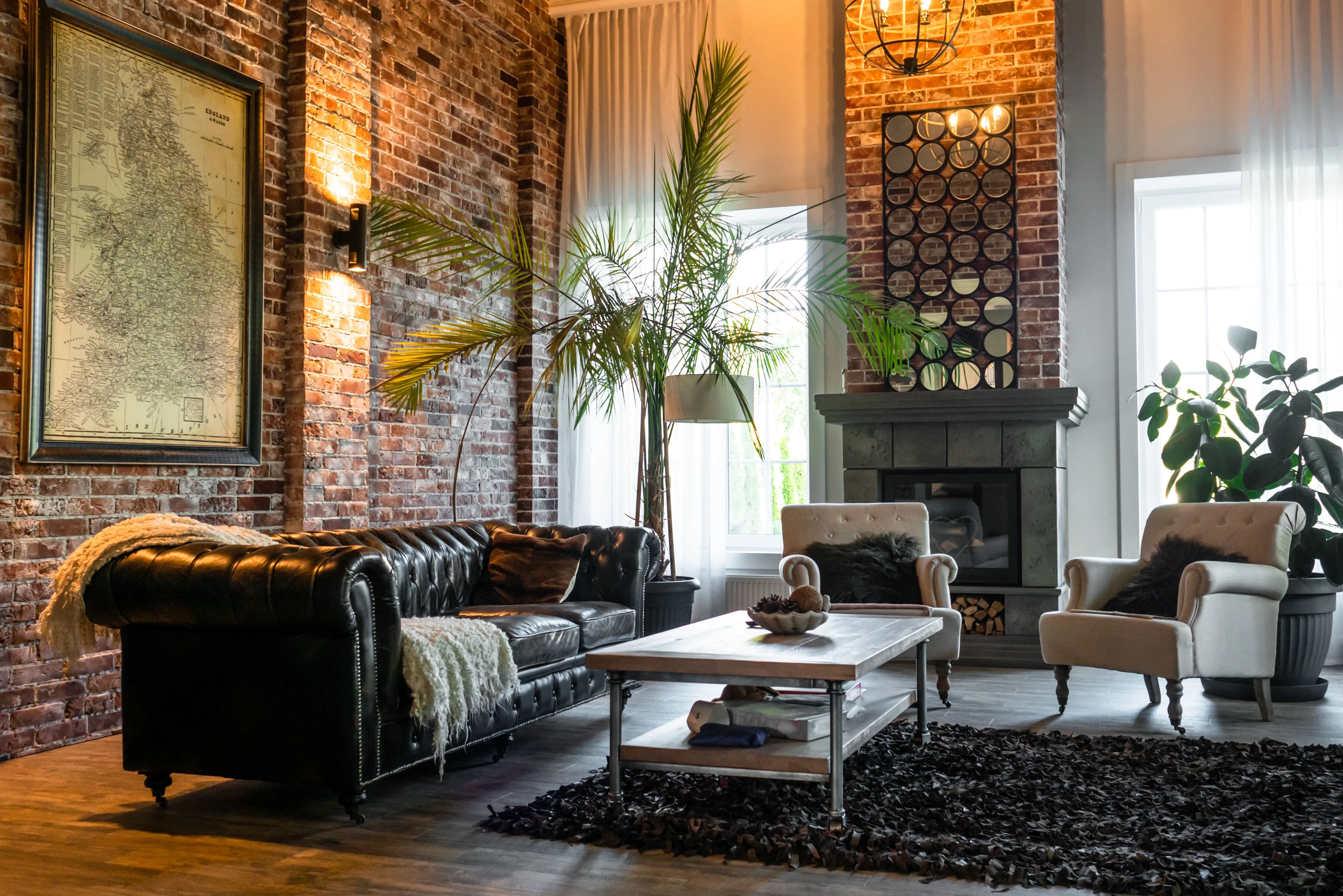 Cozy living room interior with a fireplace, house plants, and comfortable armchairs.