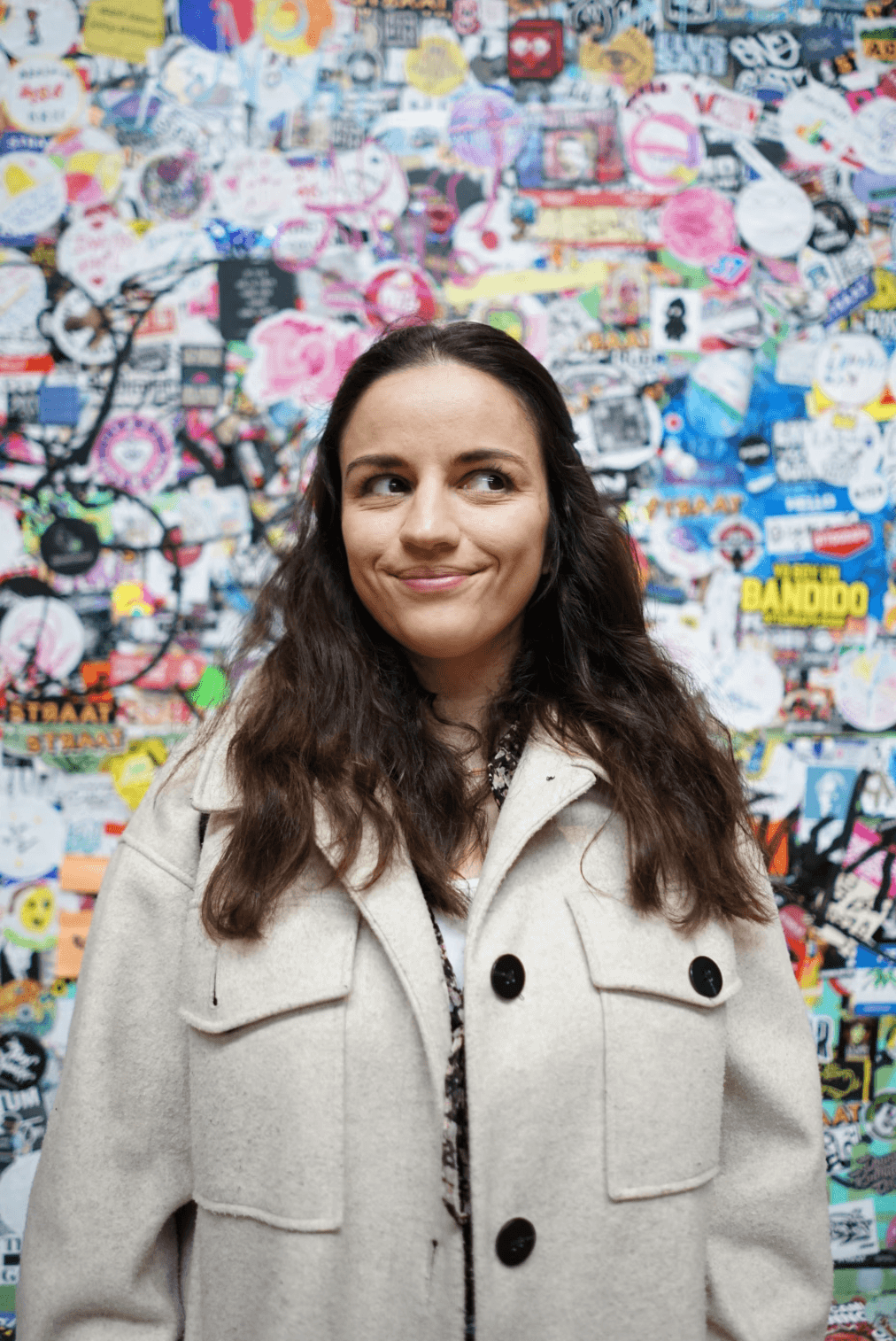 A model surrounded by photographers holding cameras