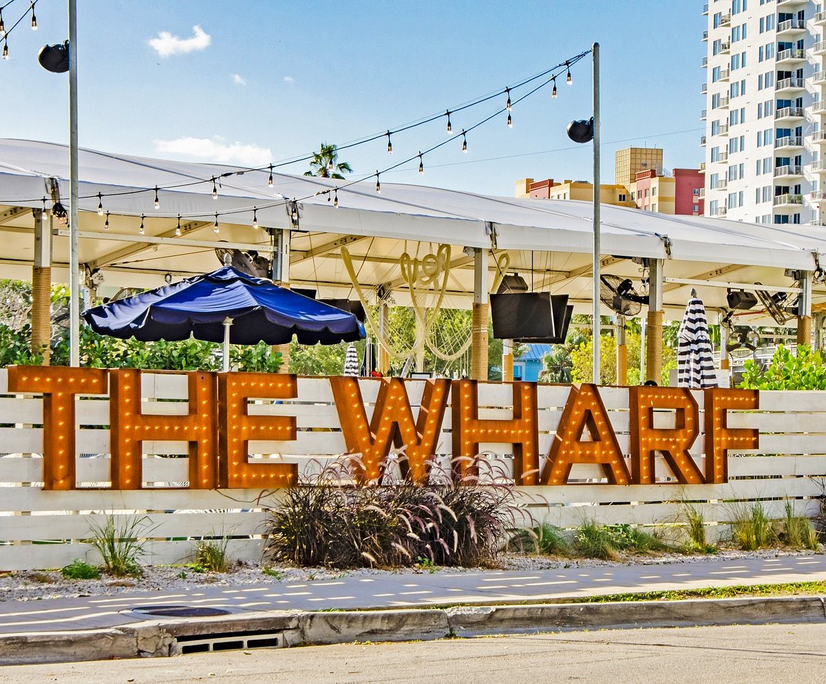 Picture of "The Wharf" sign outside of bar