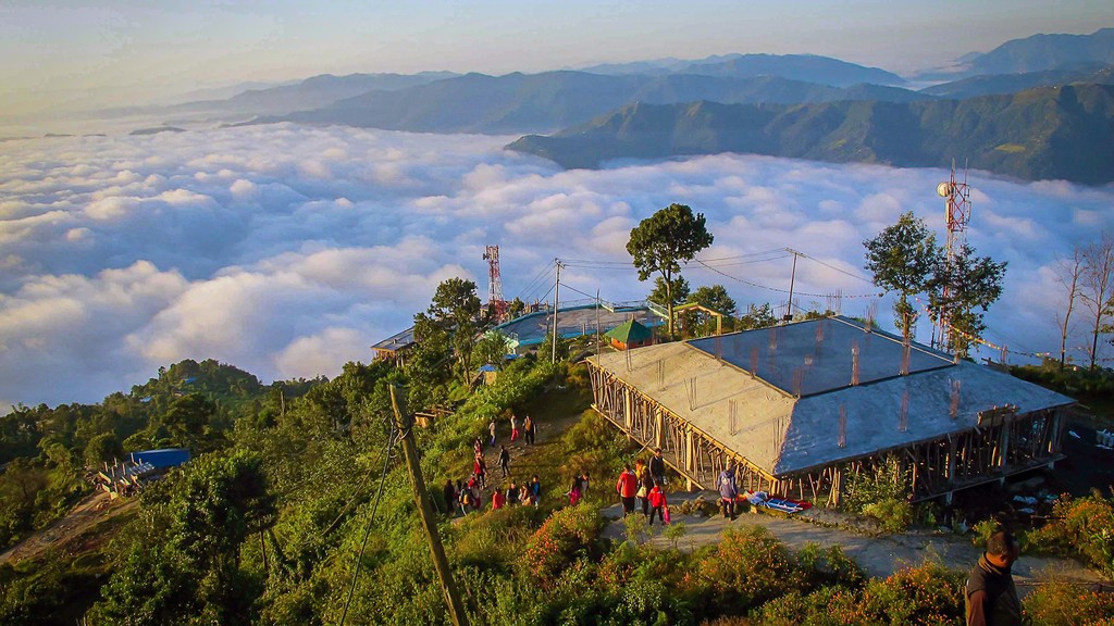 a view of a city and mountains from a distance