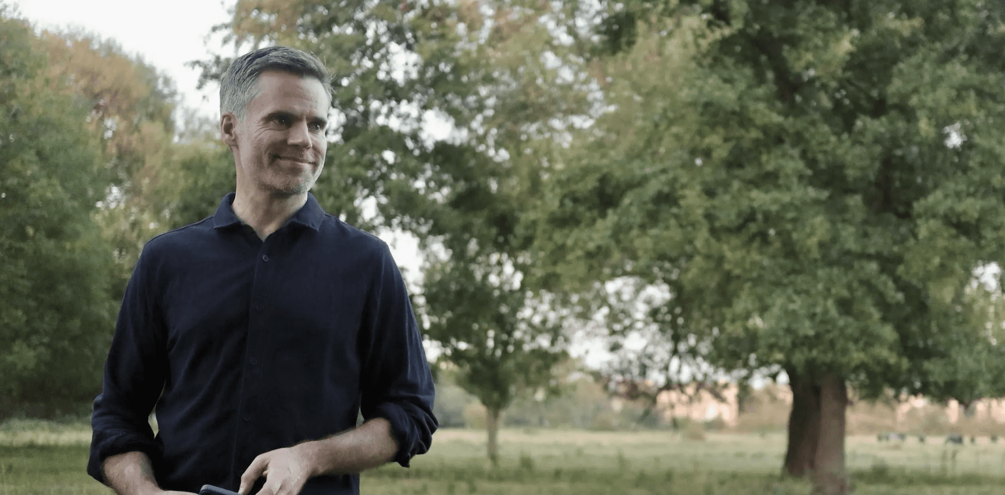 Photo of Tom standing in a field