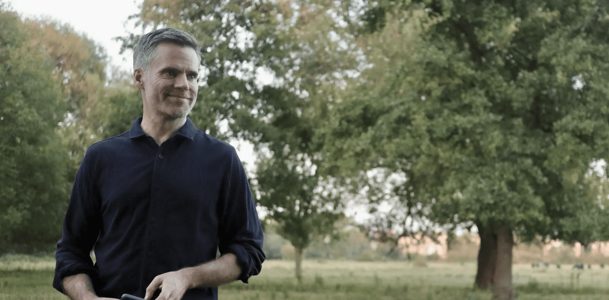 Photo of Tom standing in a field