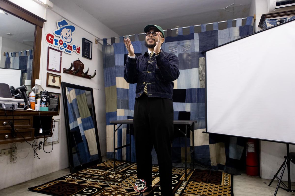 Gum Cruz barbering education in Pomade Cartel barbershop