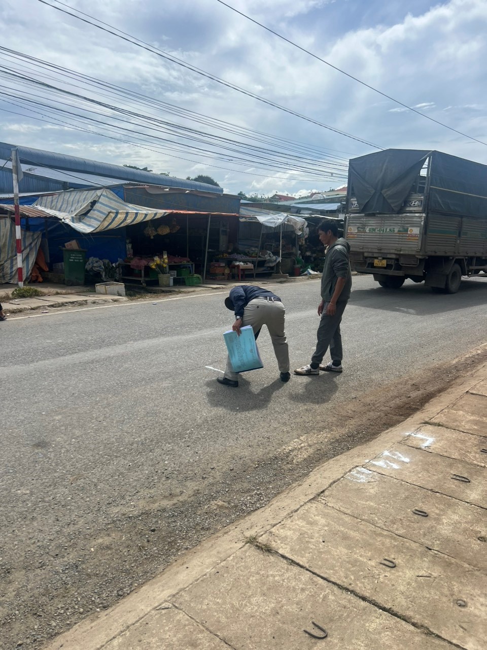 Construction workers review plans on site.
