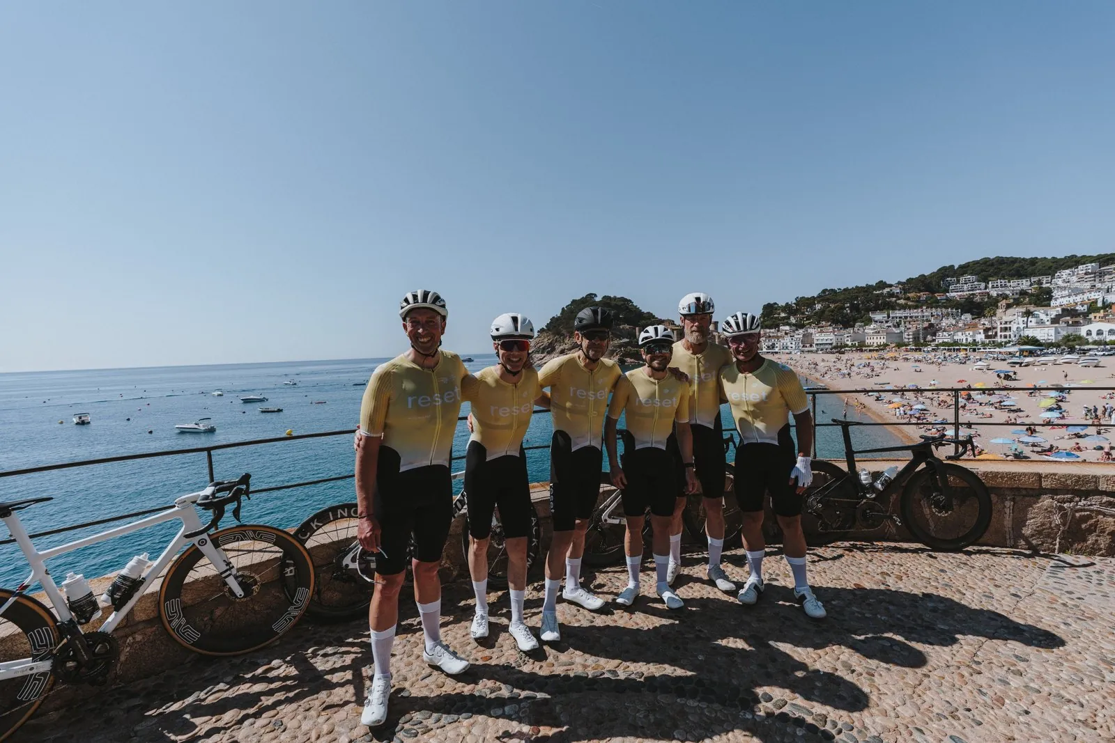 reset cc riders on the coast at Tossa de Mar during the 2026 Girona camp