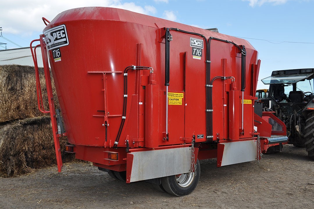 man wearing gray polo shirt beside dry-erase board
