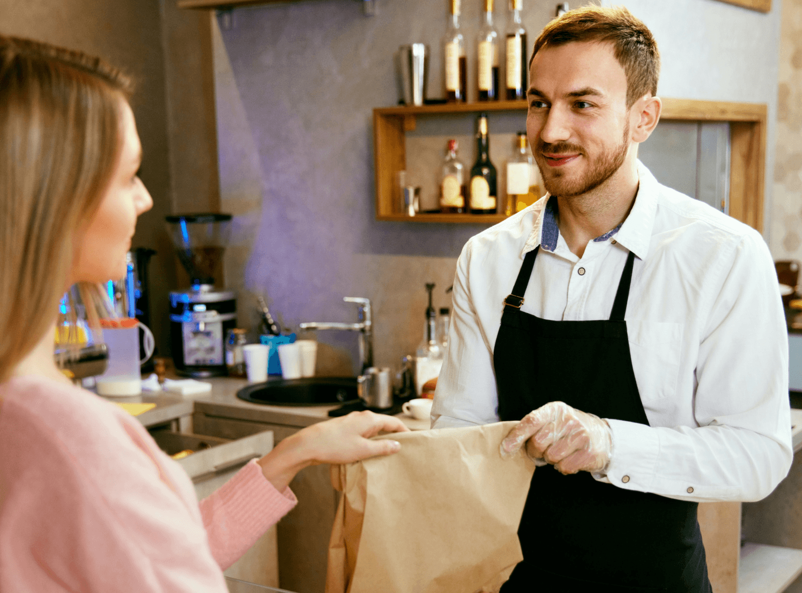 Hands planning UX design with sticky notes.
