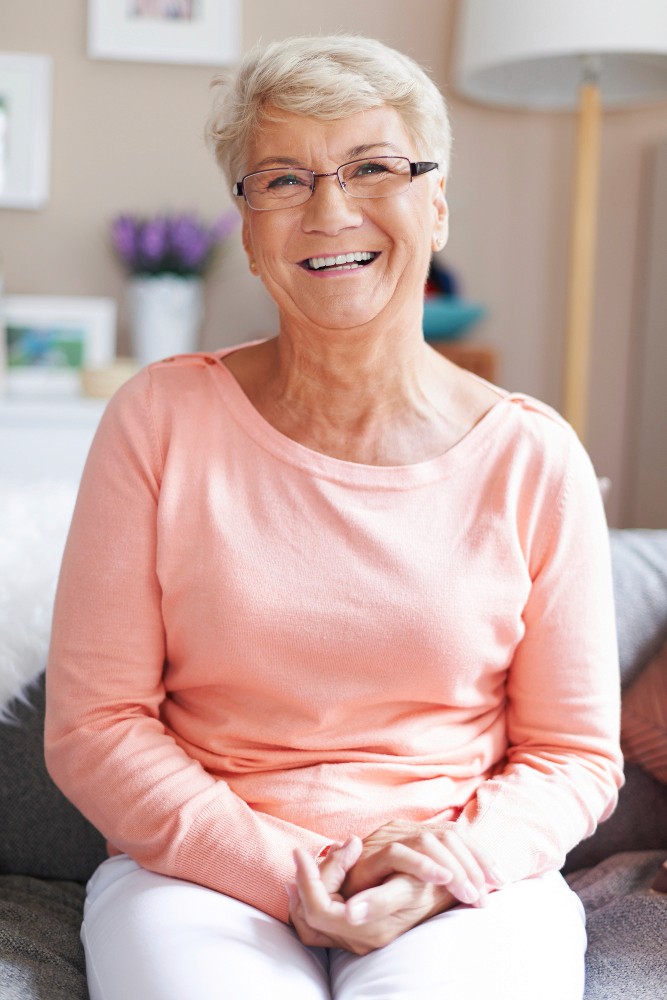 smiling woman with dental dentures