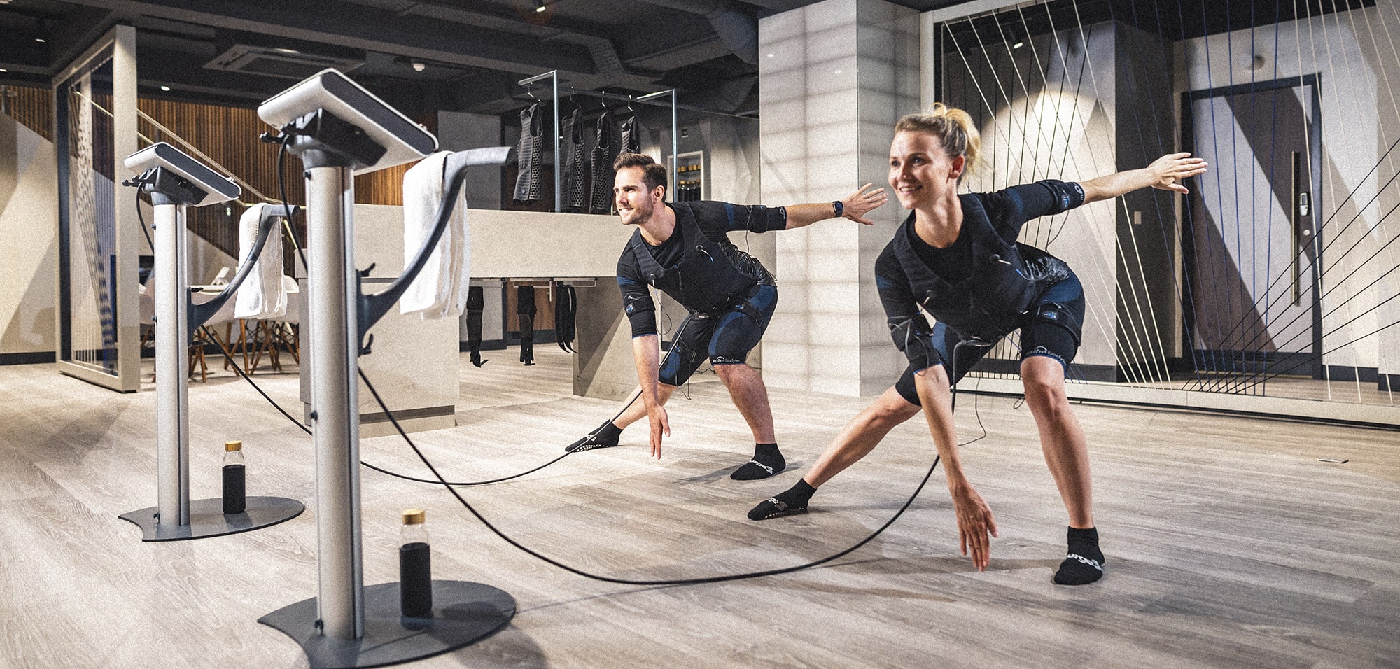 Woman running on a treadmill in a gym.