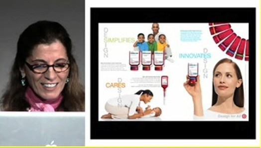 A photo of a woman with glasses, an apple logo and some poster that shows people and childcare products.
