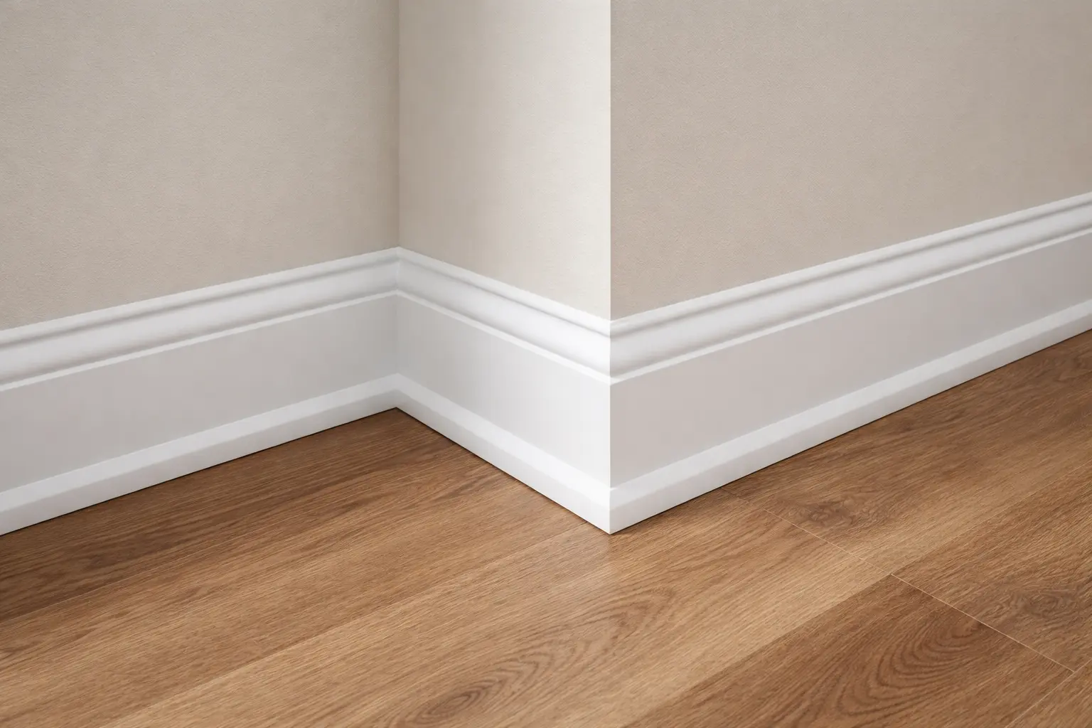 Deeply cleaned white baseboards and crown molding along a polished hardwood floor corner.