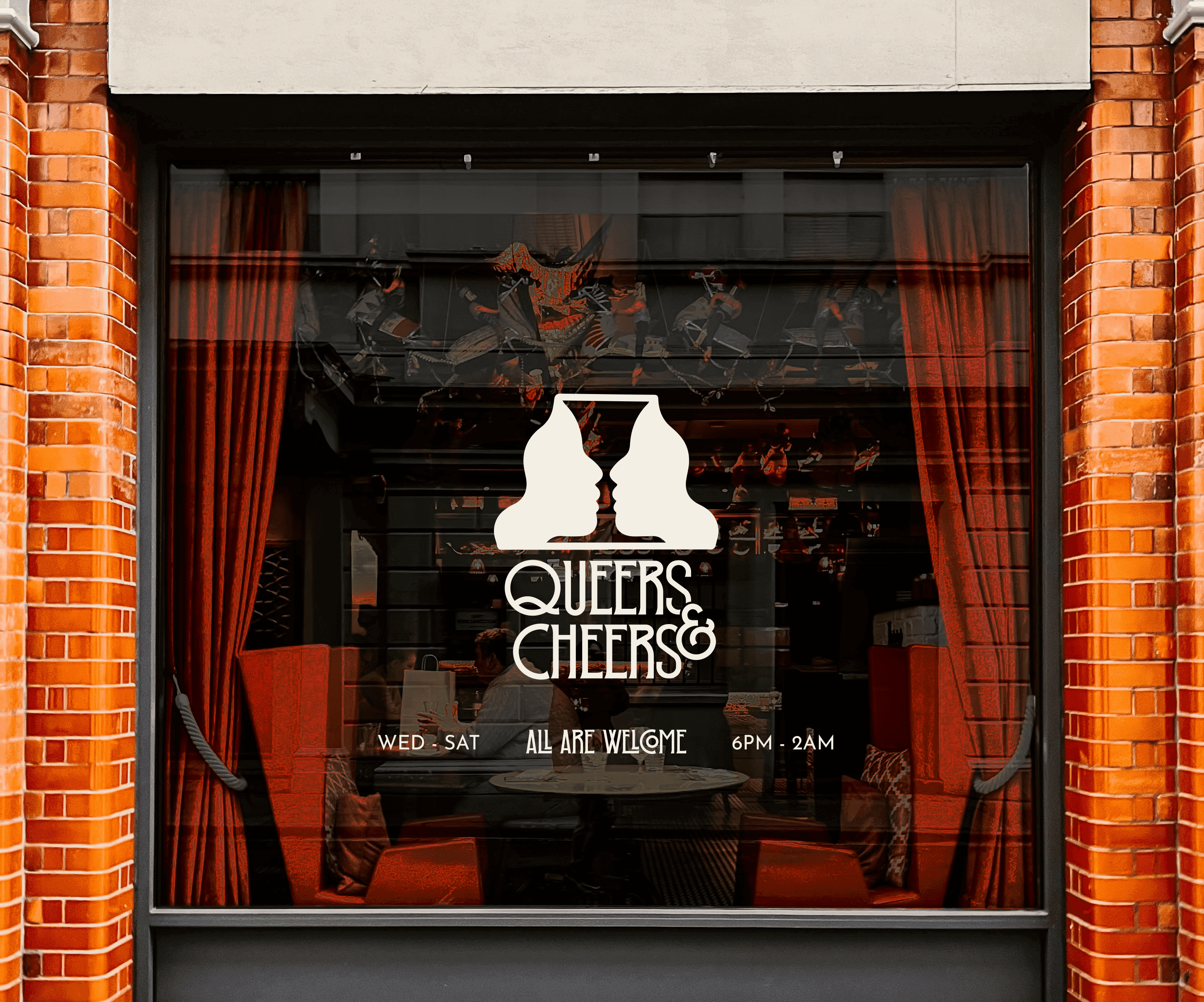 Queers & Cheers bar window, logo of two faces forming a wine glass.