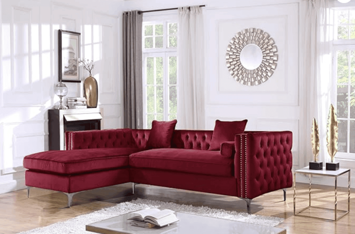 Burgundy Iconic Home Da Vinci tufted sectional sofa in a luxurious living room with white walls & decorative accents