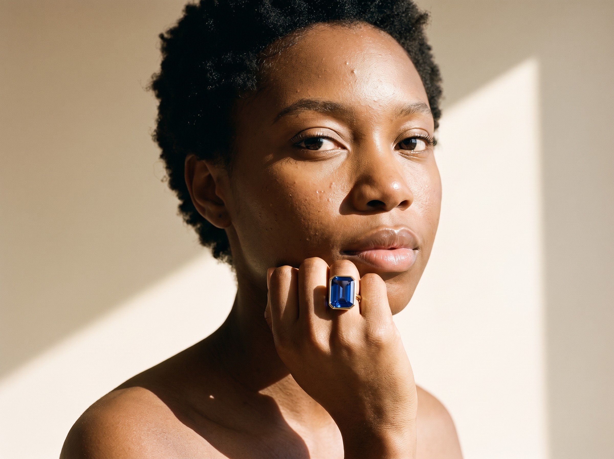 AI model wearing sapphire ring, campaign photography