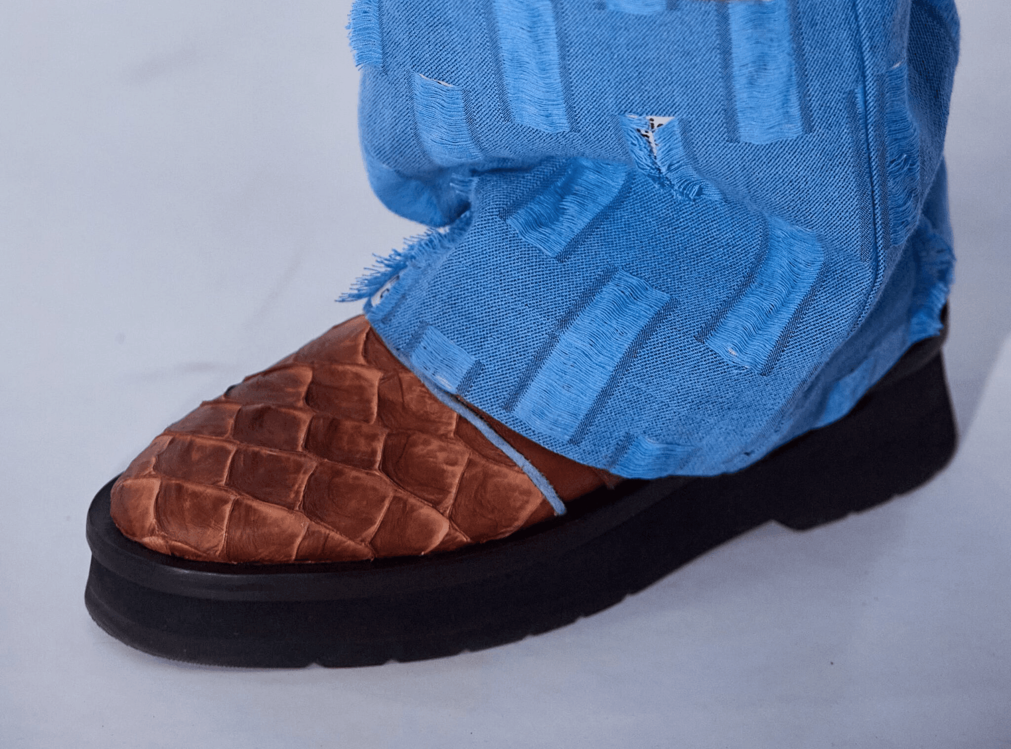 two people looking at a tablet and smiling