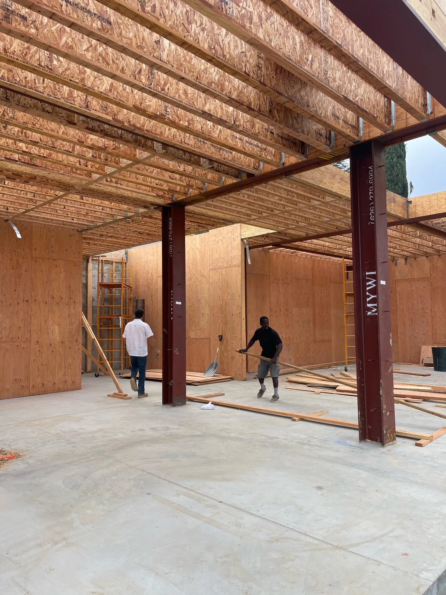 Interior structural framing with steel beams and engineered wood floor system.