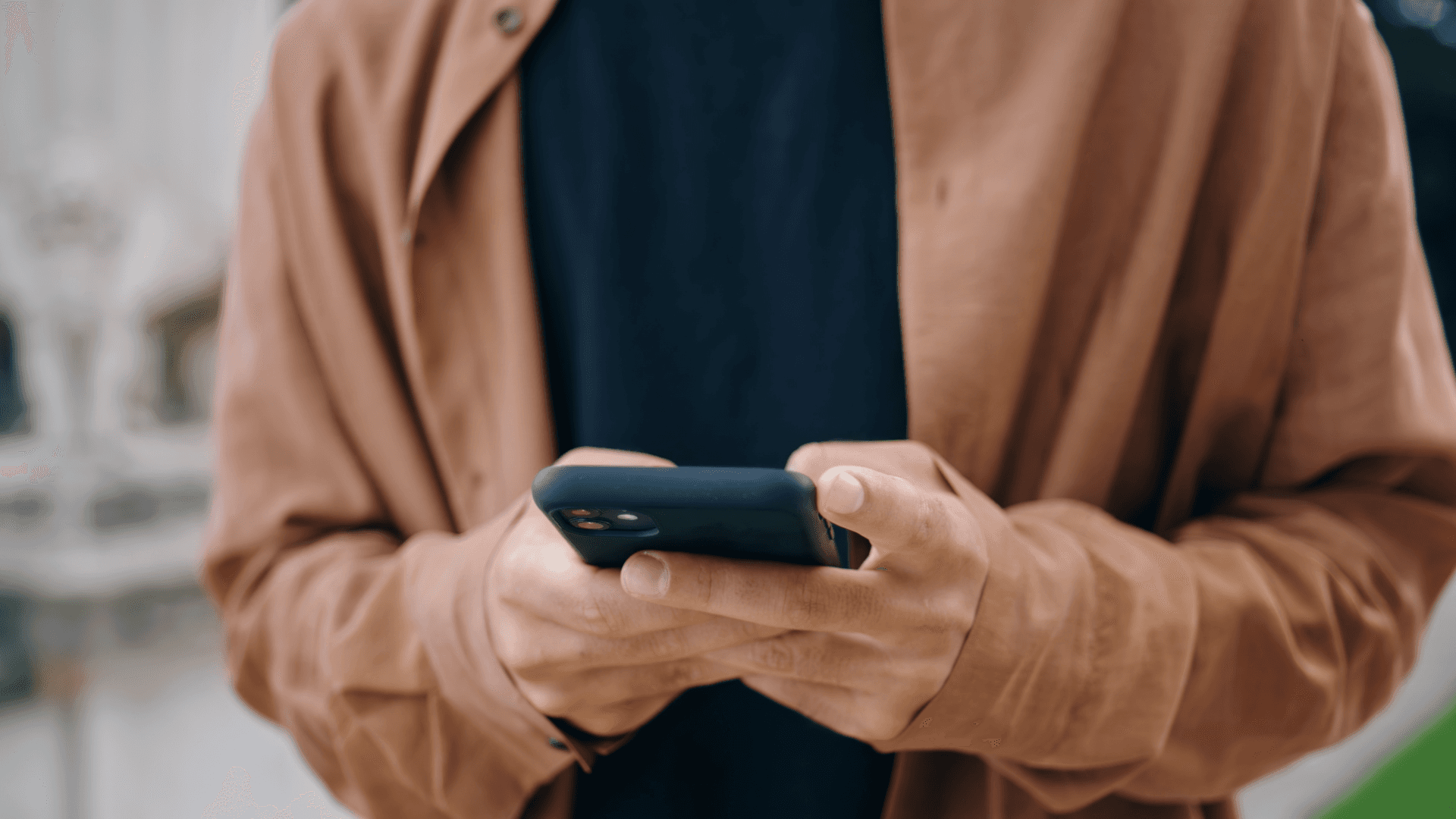 A person typing on their phone.