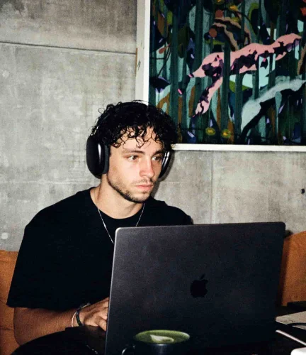 Reilin working behind his laptop