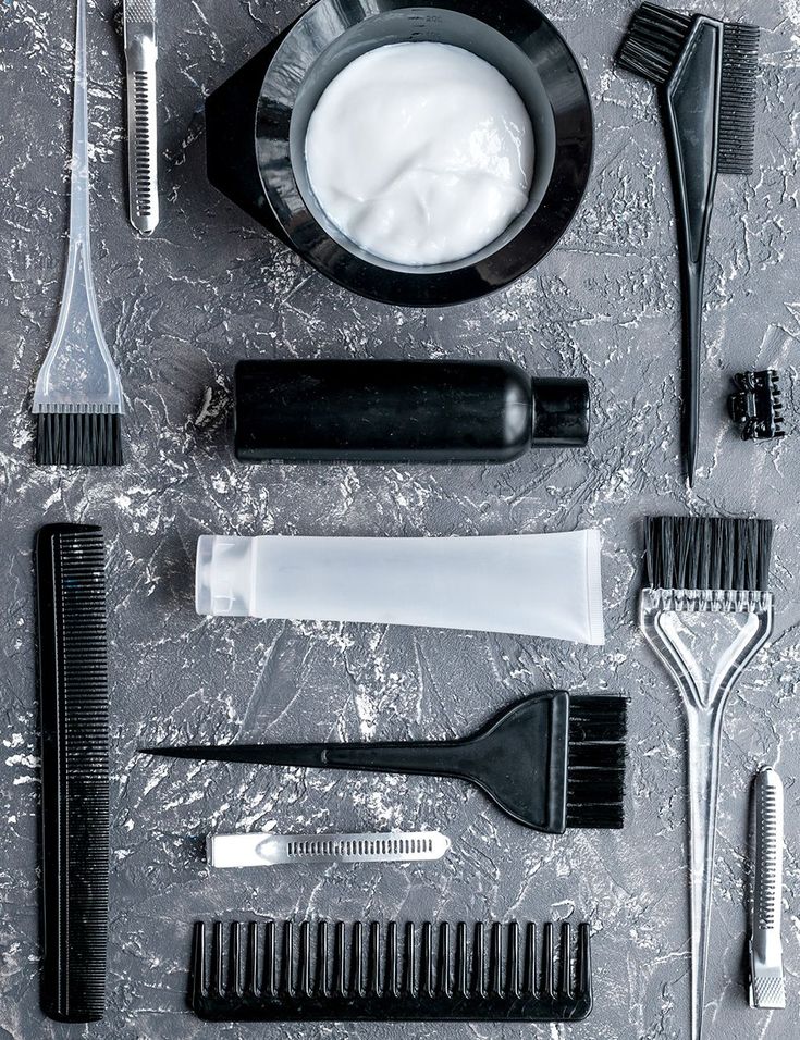 a man getting his hair washed in a sink