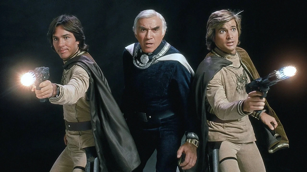 Three characters dressed in futuristic space uniforms stand confidently, holding glowing blaster weapons, against a dark background, evoking a classic sci-fi adventure theme.