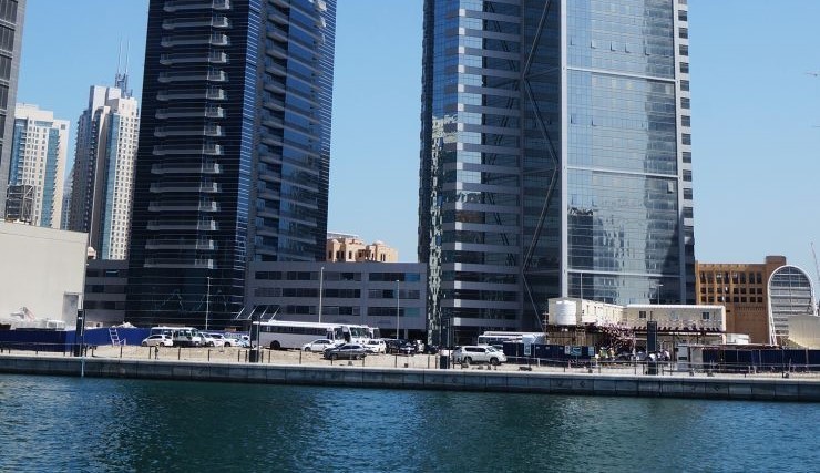 Waterfront view of Business Bay skyline featuring modern office architecture and prime road access.