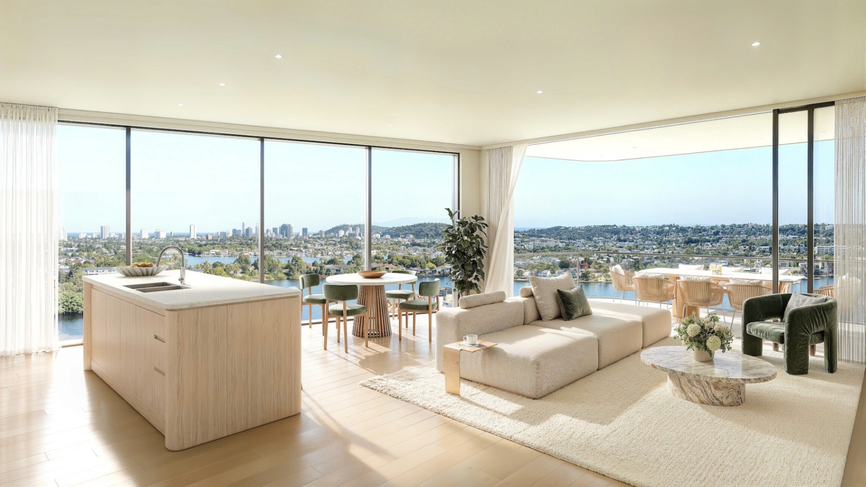 Open-plan living and kitchen at COMO Varsity Lakes with large windows and balcony overlooking Lake Orr and Gold Coast skyline