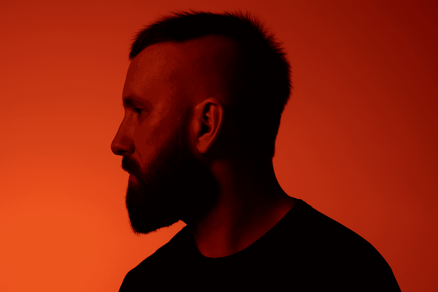Person, holding a white rose behind his back with one arm on a light blue background