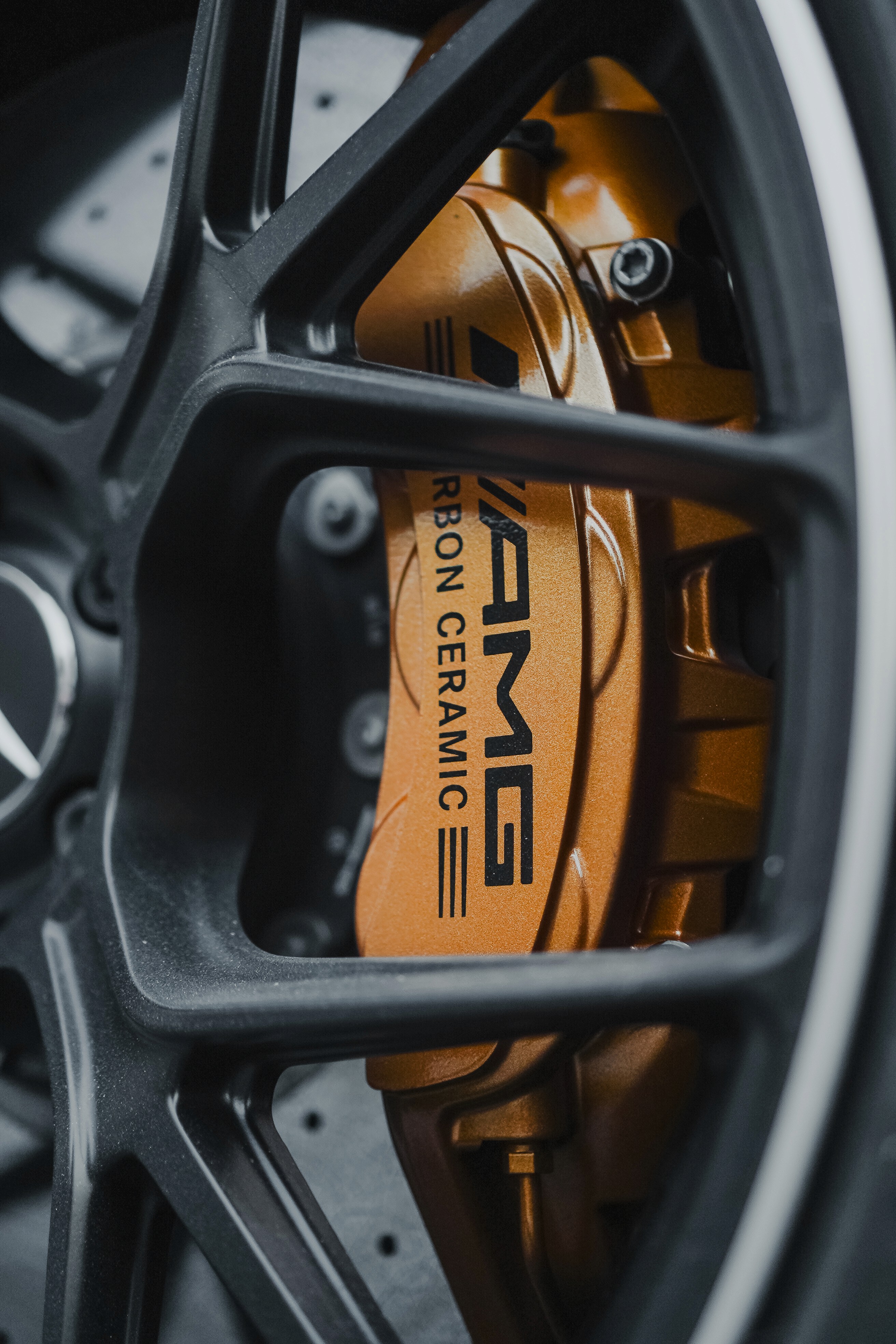 Luxury cars parked inside store.