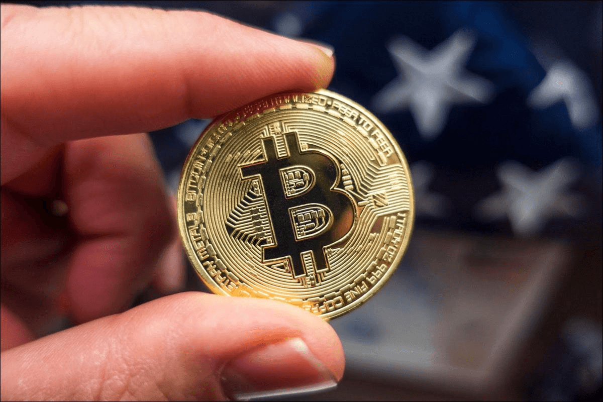 Man holding BTC - Should I Buy Bitcoin Now