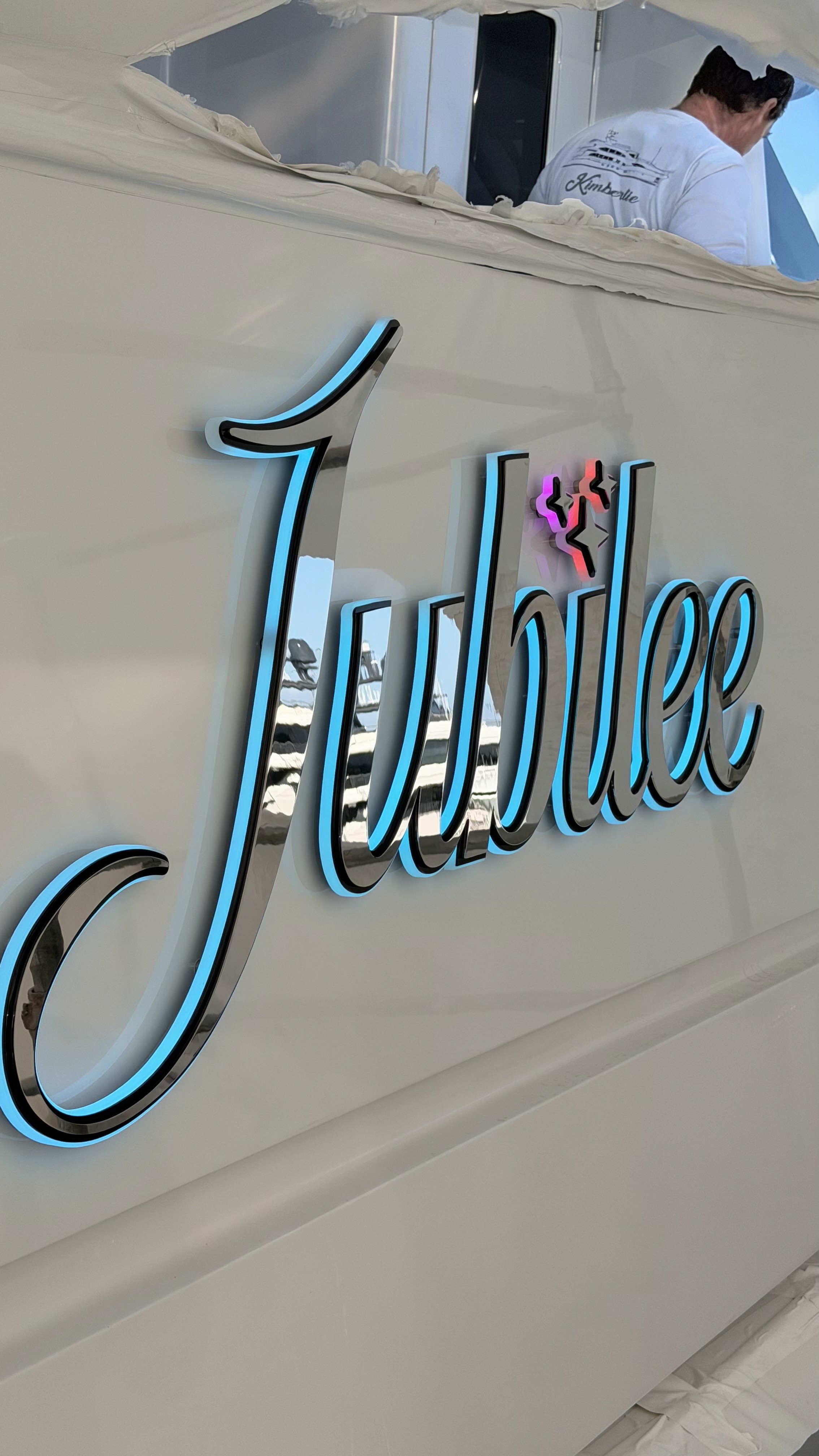3D illuminated chrome and blue yacht name lettering Jubilee close-up