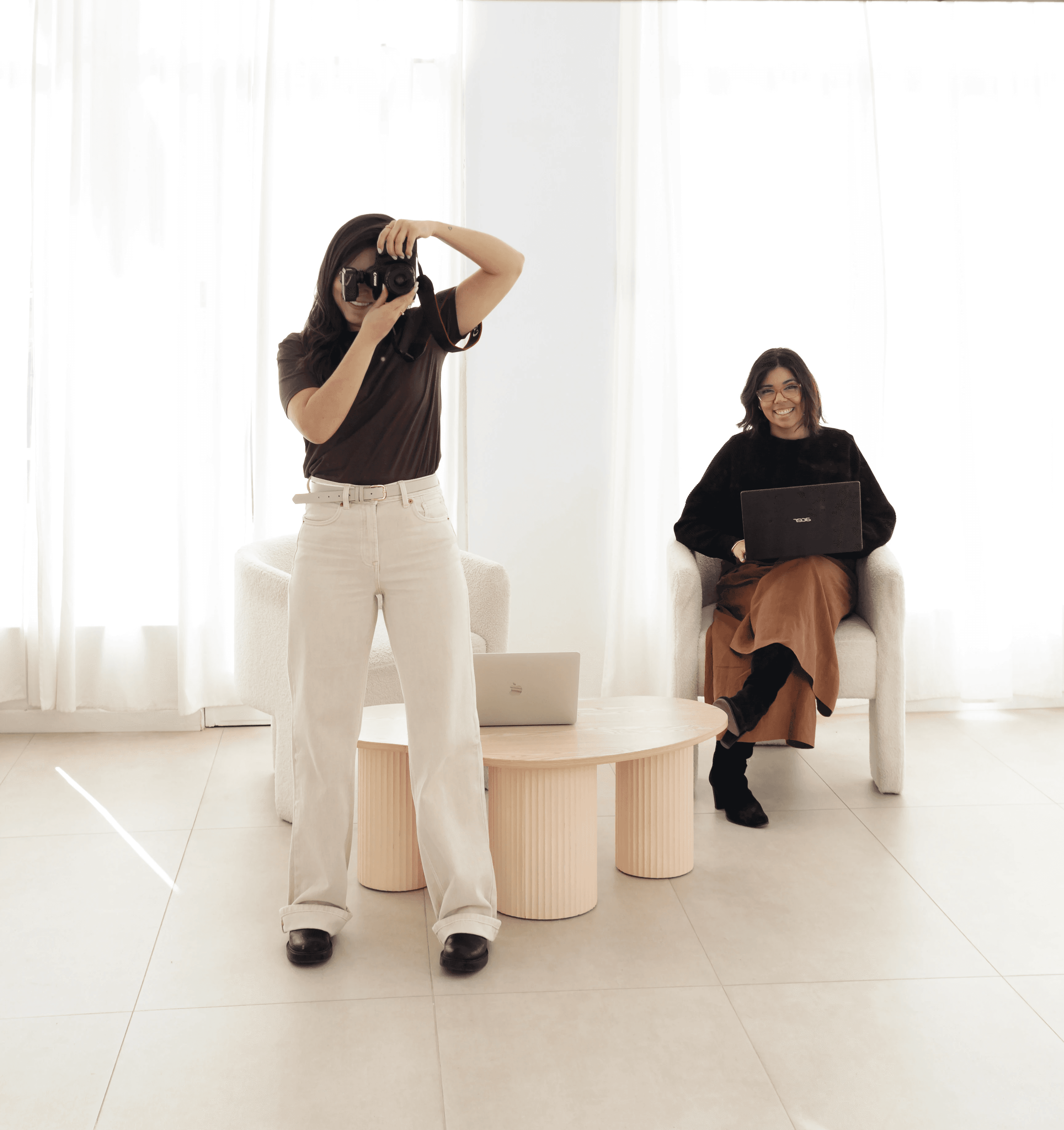 Patricia Ordoñez brand and web designer founder of Rara Design Studio in a photoshoot with Camila in a bright studio