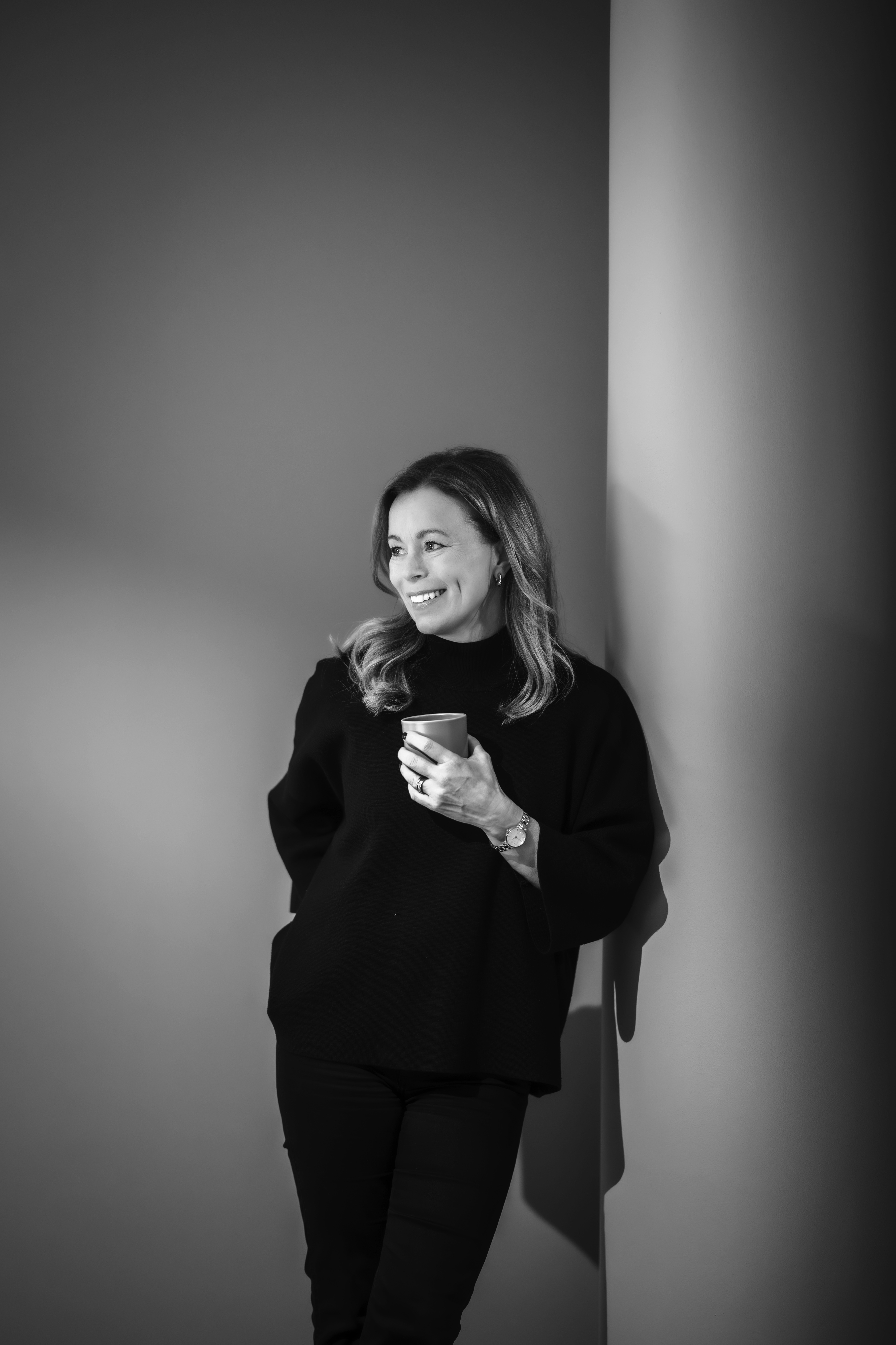 a man in a yellow shirt is on a red track