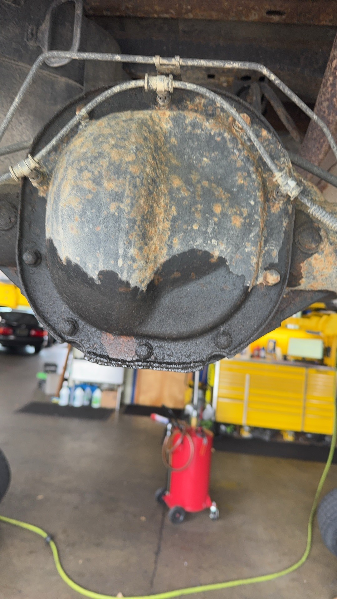 Rear differential cover on the F-150, wet with gear oil at the lower edge