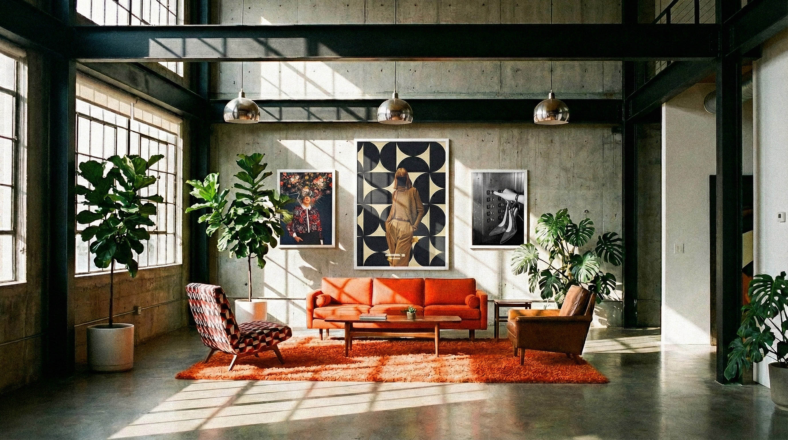 Three framed artworks styled on a gallery wall in a contemporary residential interior