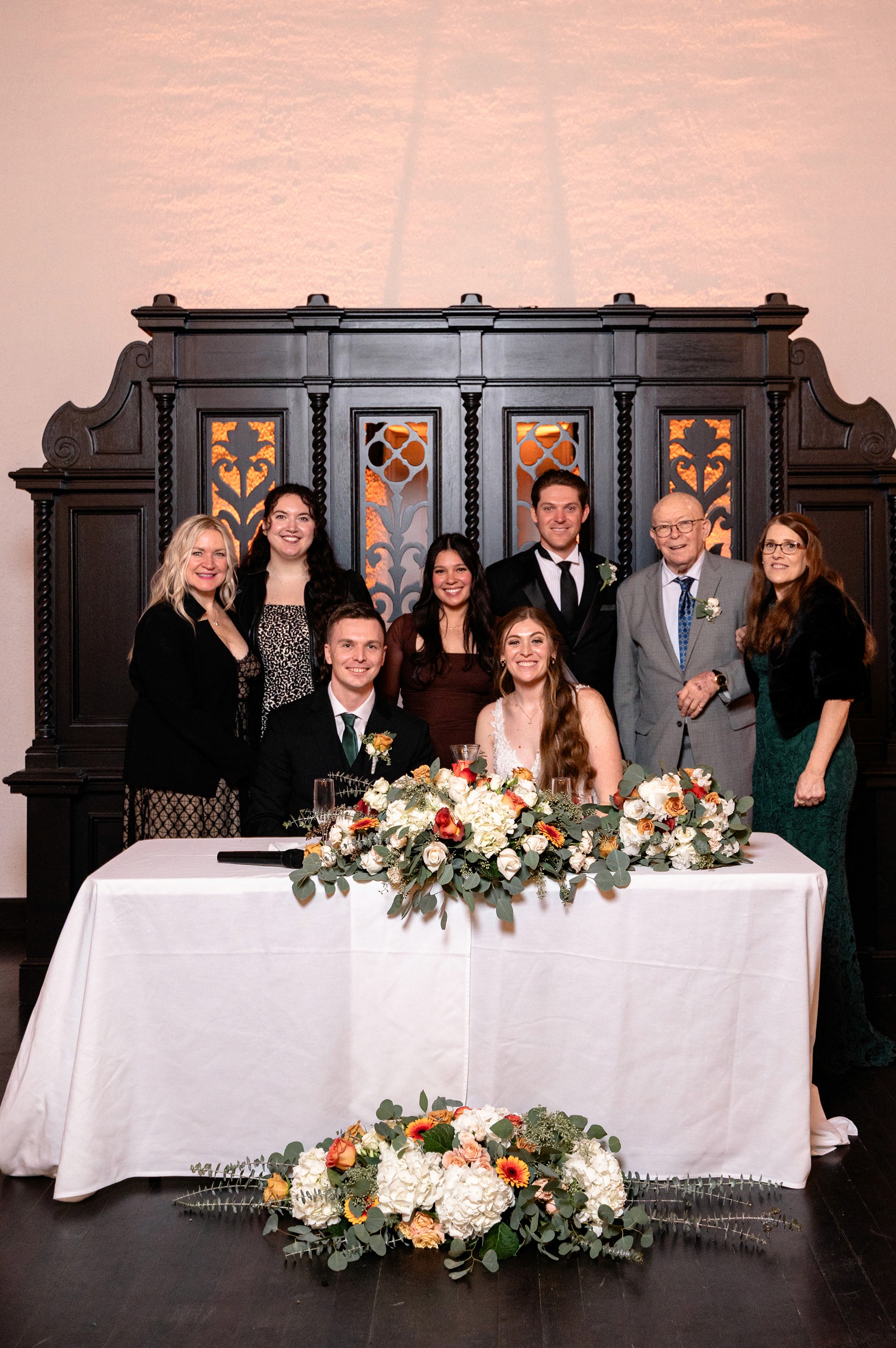 Flat lay wedding details with bouquet, rings, and sparkling bridal heels