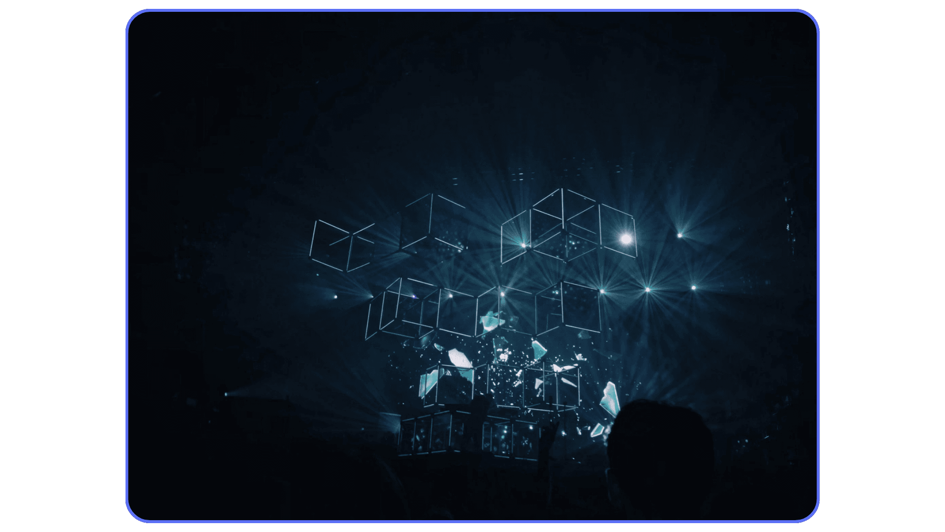 Digital cubes illuminated by blue light beams on a dark stage, symbolizing virtual data or cloud computing visualization.
