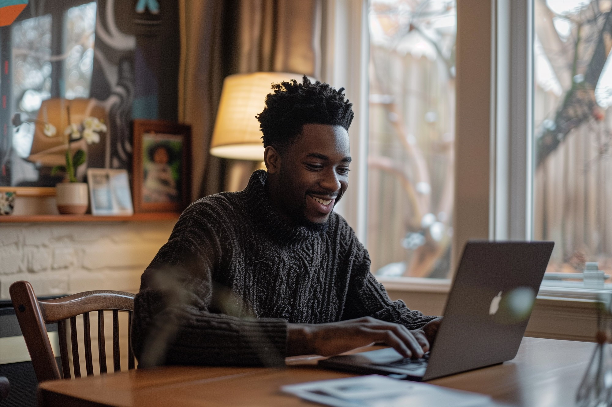 Person working on a laptop at a desk
