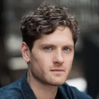 Kyle Soller's headshot with a blurred background