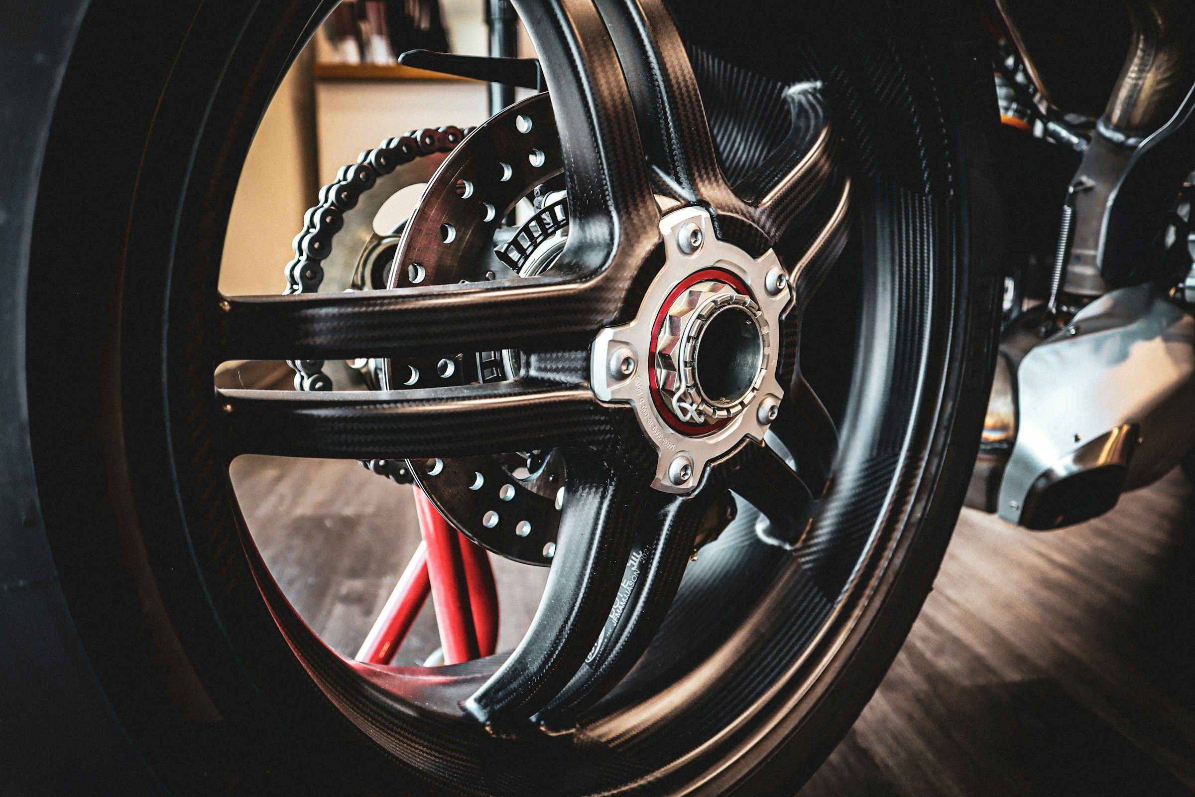 The rear wheel and sprocket of a sport bike